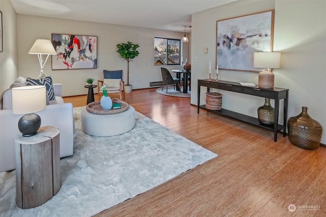 living room featuring hardwood / wood-style floors and a baseboard radiator