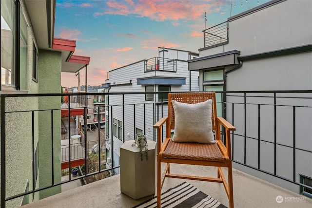 view of balcony at dusk