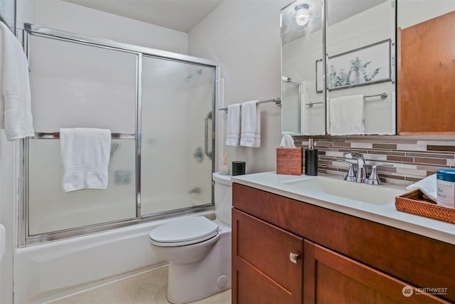 full bathroom with shower / bath combination with glass door, vanity, backsplash, and toilet