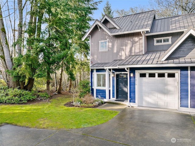 view of front of house with a front yard and a garage