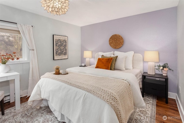 bedroom with wood-type flooring