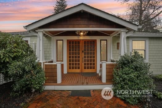 outdoor structure at dusk featuring a porch