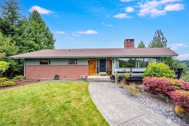 ranch-style home featuring a front yard