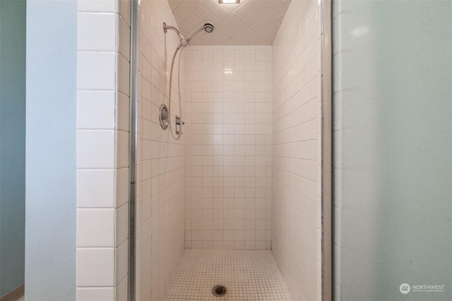 bathroom with tiled shower