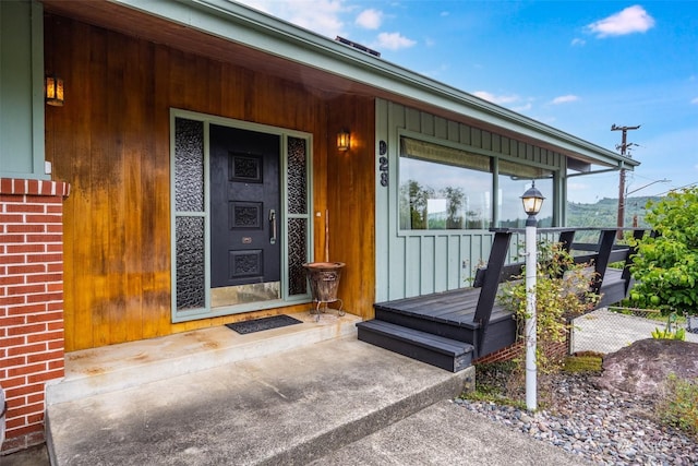 doorway to property with a porch