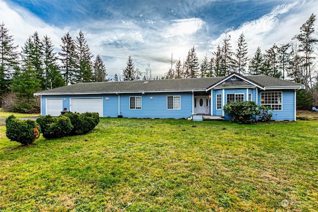 single story home featuring a front lawn and a garage