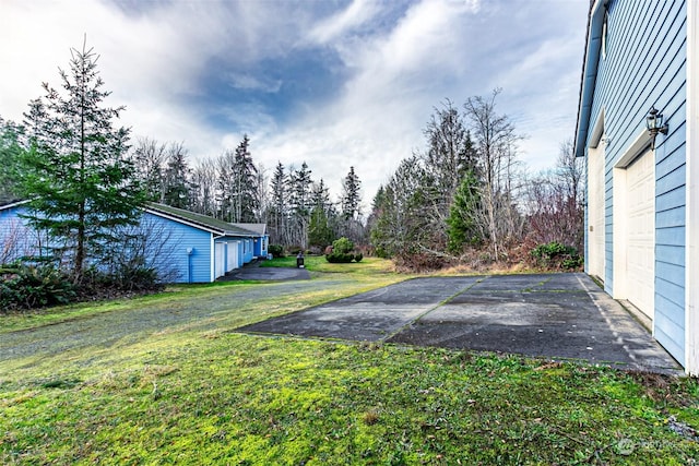 view of yard featuring a garage