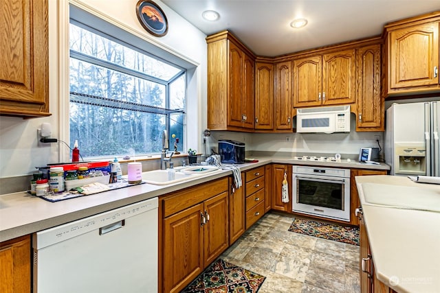 kitchen with white appliances and sink