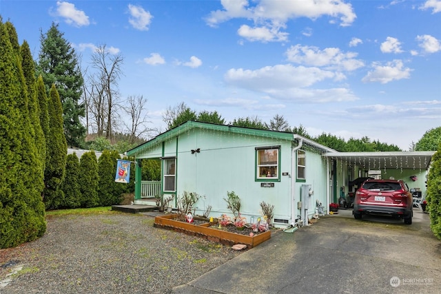 view of front of property with a carport