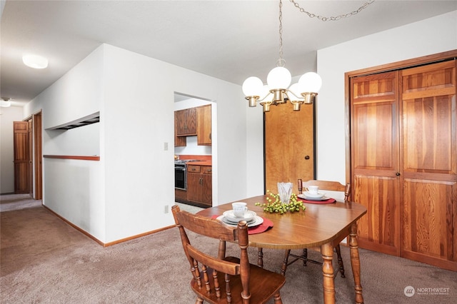 dining space with an inviting chandelier and carpet