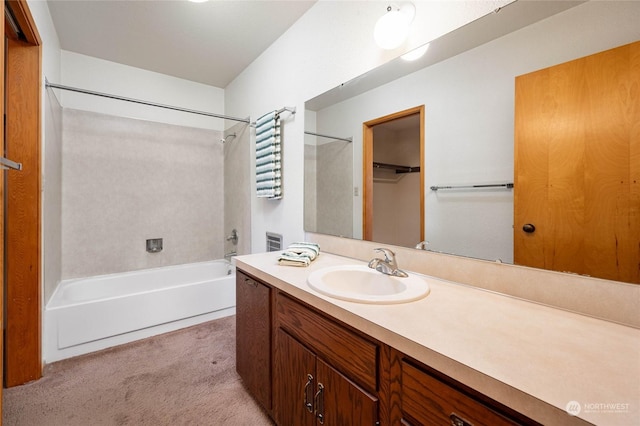 bathroom featuring vanity and shower / bath combination