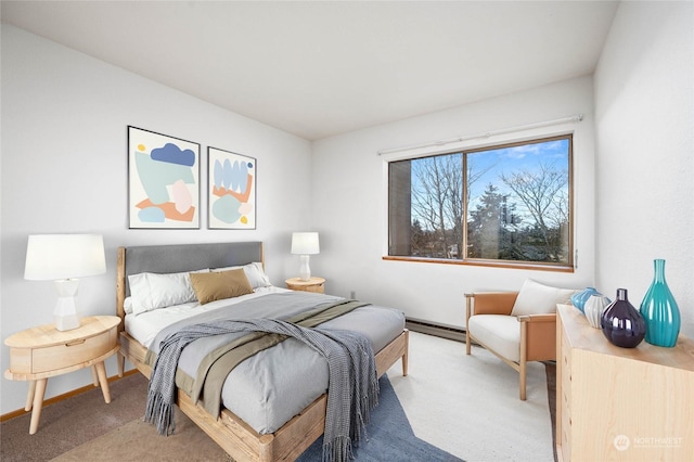 carpeted bedroom featuring baseboard heating