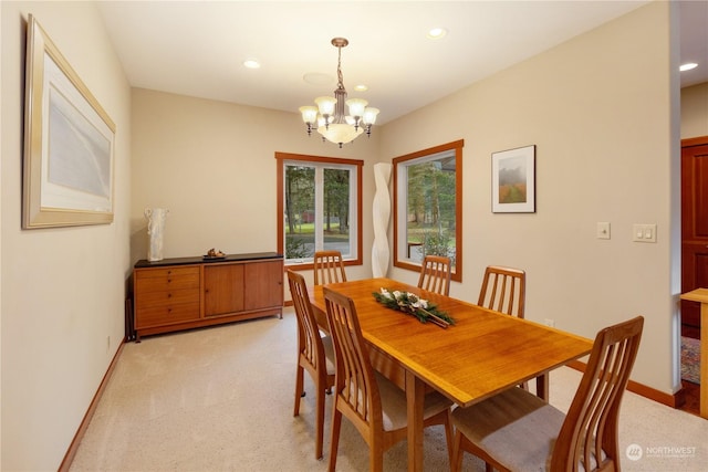 dining space featuring light carpet, baseboards, a chandelier, and recessed lighting