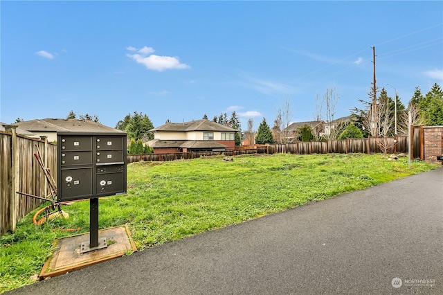 view of yard featuring mail boxes