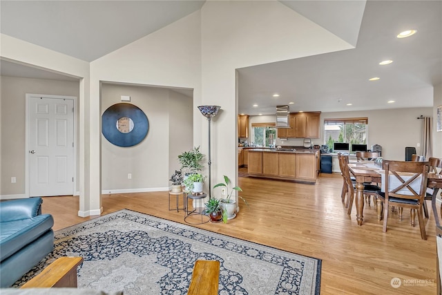 interior space featuring light hardwood / wood-style floors and vaulted ceiling