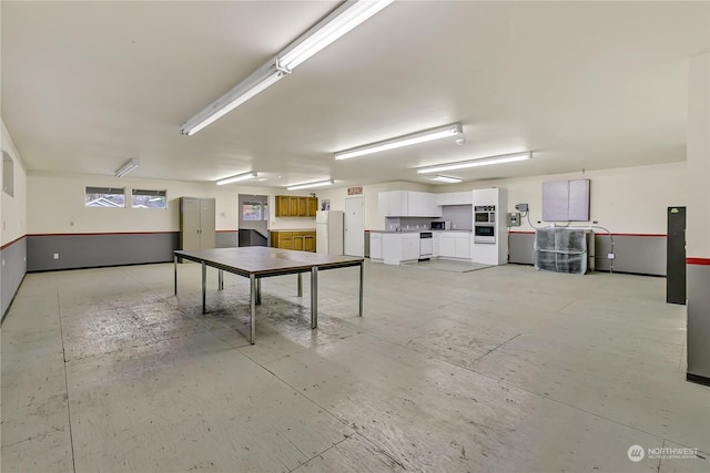 basement featuring white refrigerator