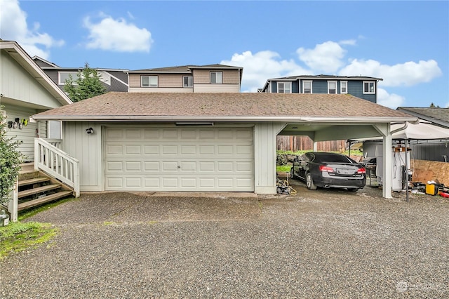 garage featuring a carport