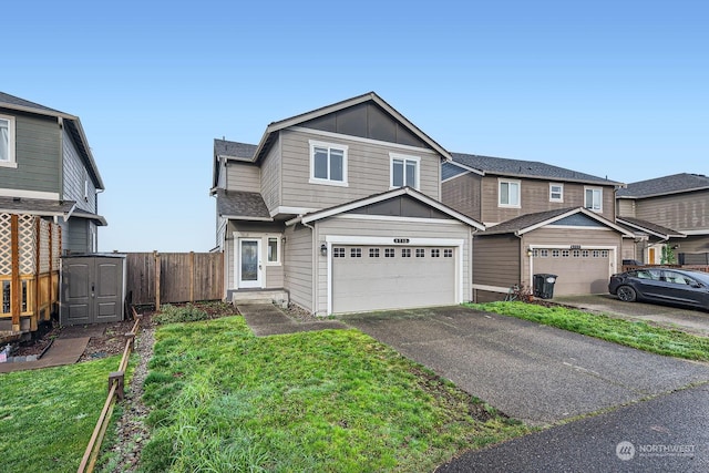 view of front of home featuring a garage and a front lawn