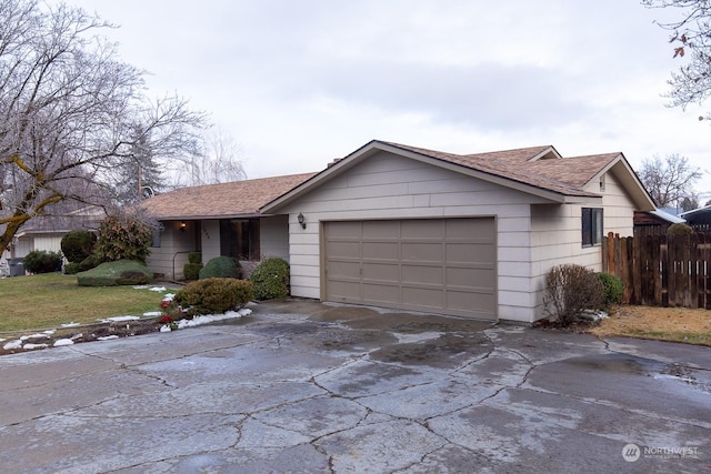 ranch-style house featuring a garage