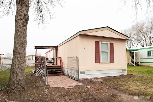 view of property exterior featuring a lawn