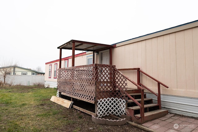 deck featuring a lawn