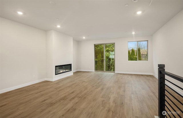 unfurnished living room featuring light hardwood / wood-style flooring