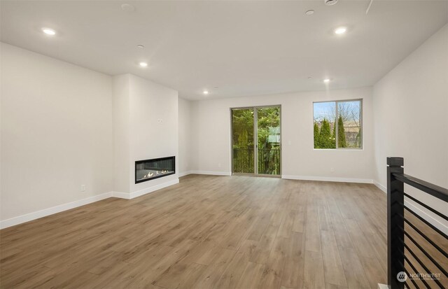 unfurnished living room featuring light hardwood / wood-style floors