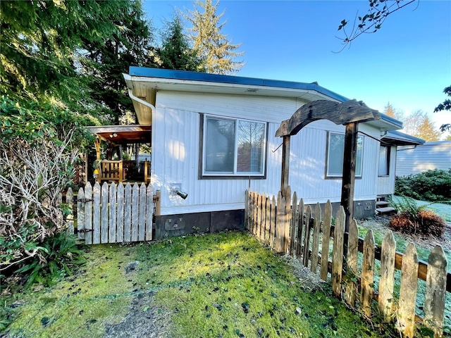 view of home's exterior with a yard