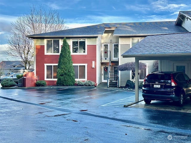 view of front of home featuring a carport