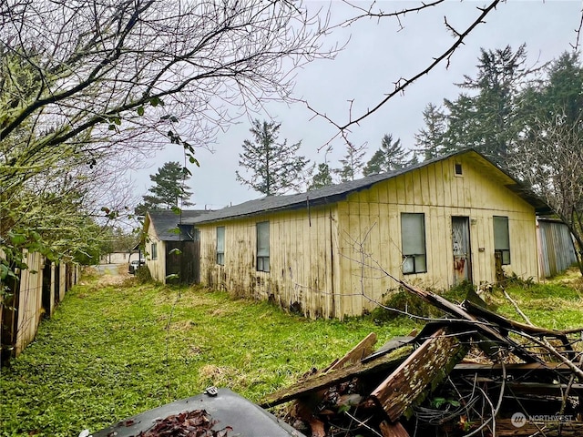 view of home's exterior with a lawn