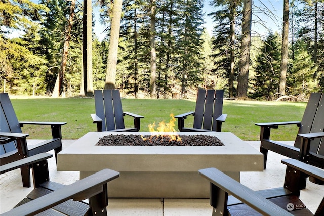 view of patio / terrace featuring an outdoor fire pit