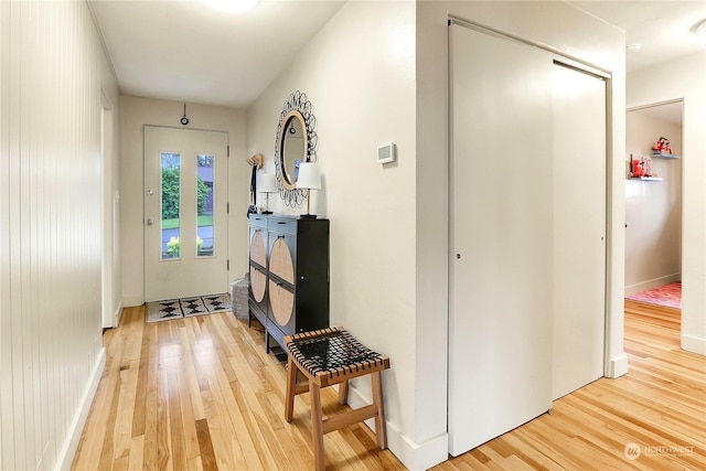 entryway with hardwood / wood-style flooring