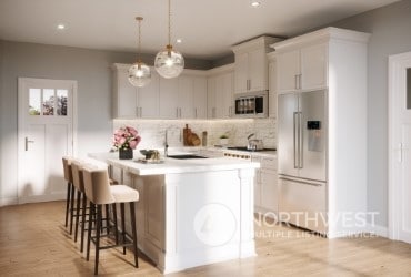 kitchen with sink, high end refrigerator, pendant lighting, a kitchen island with sink, and white cabinets