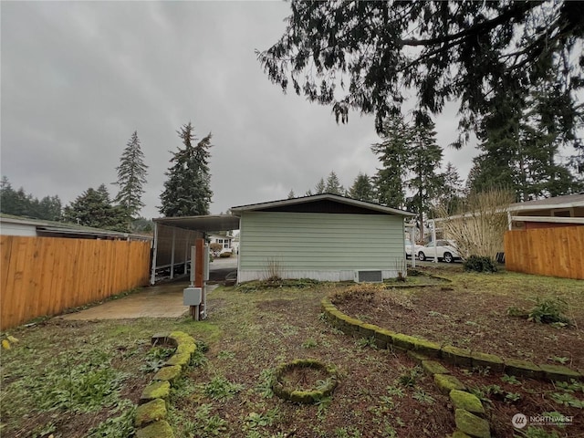 back of property featuring a carport