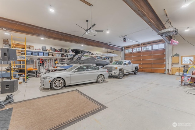 garage featuring ceiling fan and a garage door opener