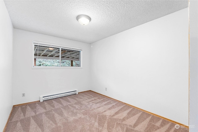 empty room featuring carpet floors, a textured ceiling, and a baseboard radiator