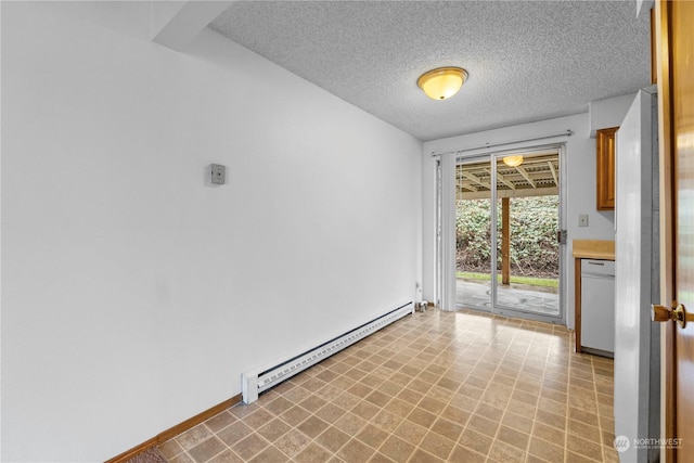 unfurnished room featuring baseboards, baseboard heating, light floors, and a textured ceiling