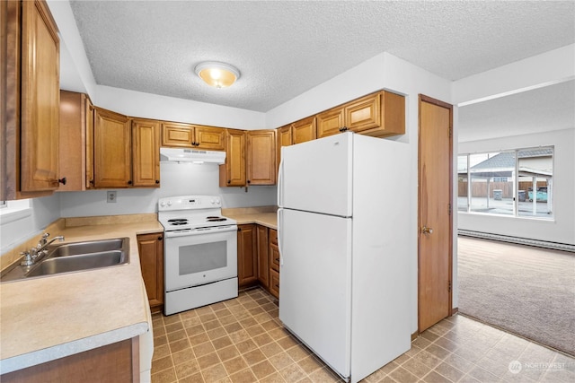 kitchen featuring a textured ceiling, white appliances, baseboard heating, and sink