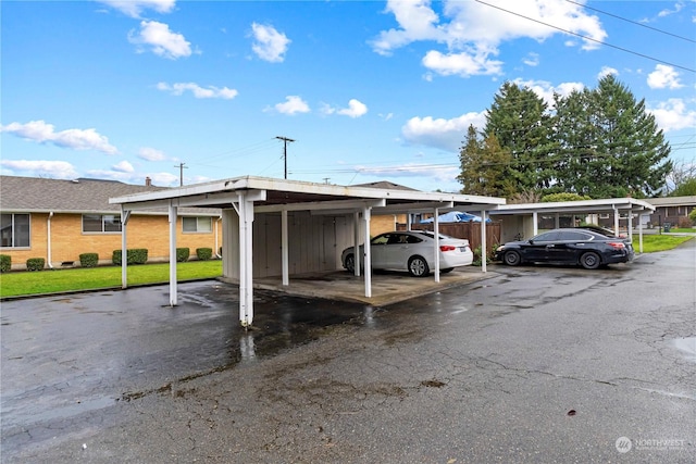 view of parking / parking lot with a carport