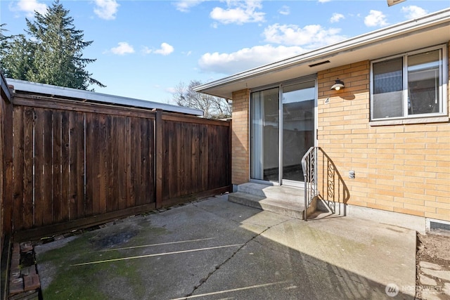 view of patio with fence and entry steps