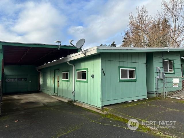 exterior space with a carport