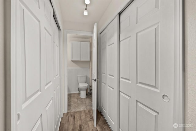 bathroom featuring toilet and hardwood / wood-style flooring