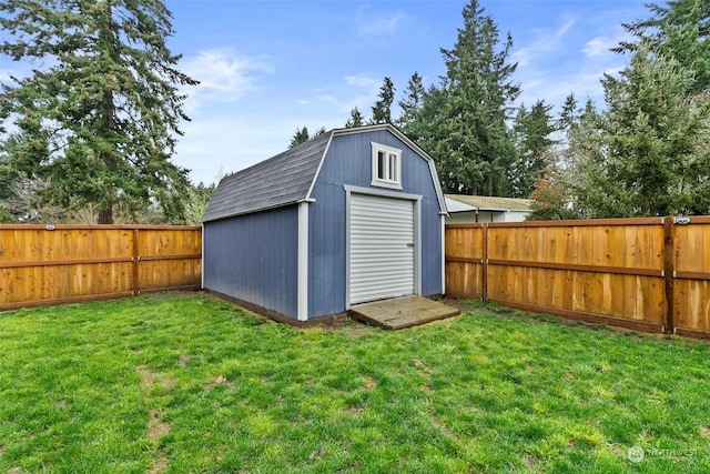 view of outdoor structure featuring a lawn