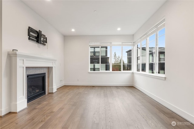 unfurnished living room with light hardwood / wood-style floors