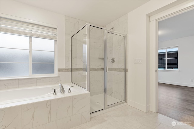 bathroom with a wealth of natural light and plus walk in shower