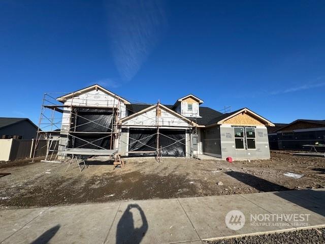 property in mid-construction with a garage