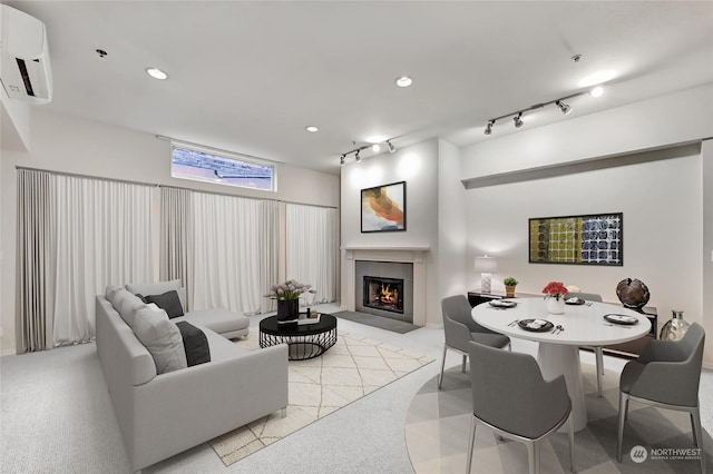 living room with rail lighting and a wall unit AC