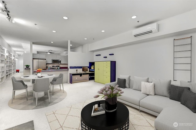 living room featuring an AC wall unit and ceiling fan