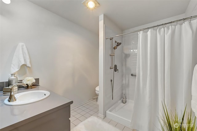 bathroom with tile patterned flooring, vanity, toilet, and a shower with shower curtain