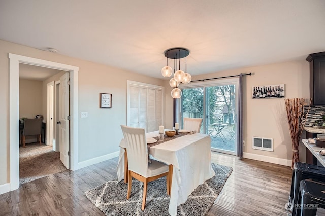 dining space featuring dark hardwood / wood-style flooring